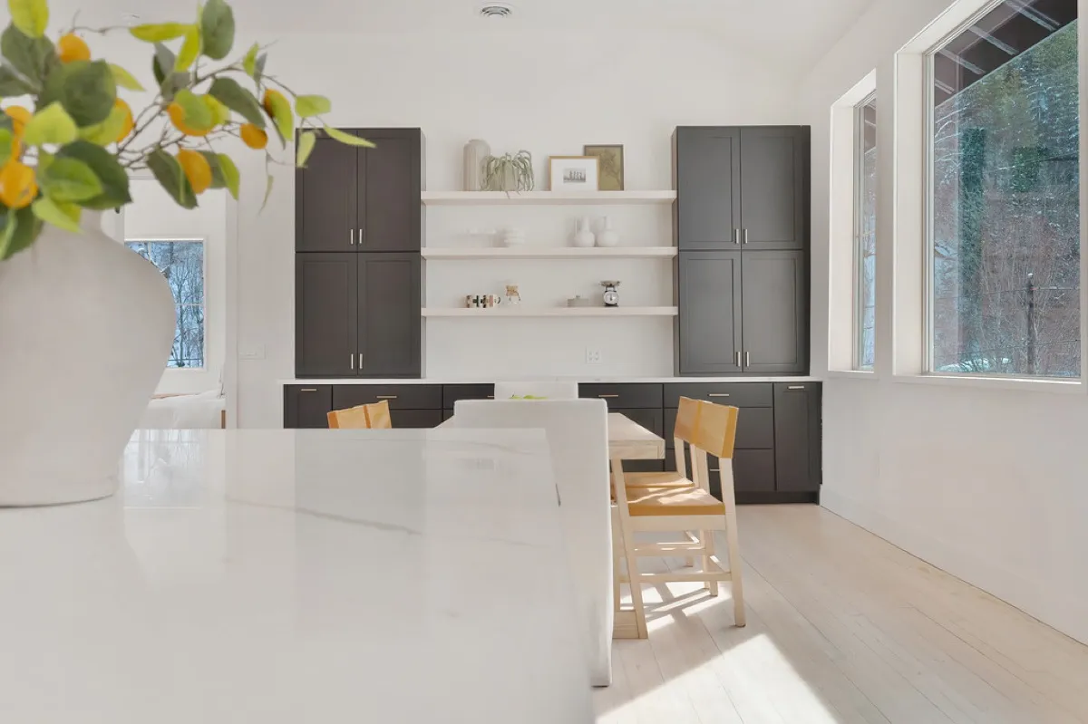 Remodeled open-concept living and kitchen space with lake views